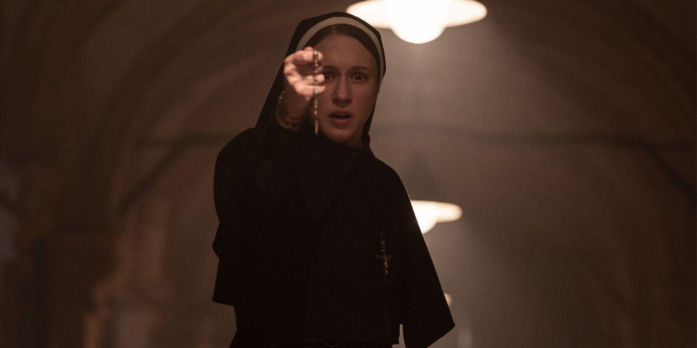 Taissa Farmiga clutching a cross as Sister Irene in The Nun II