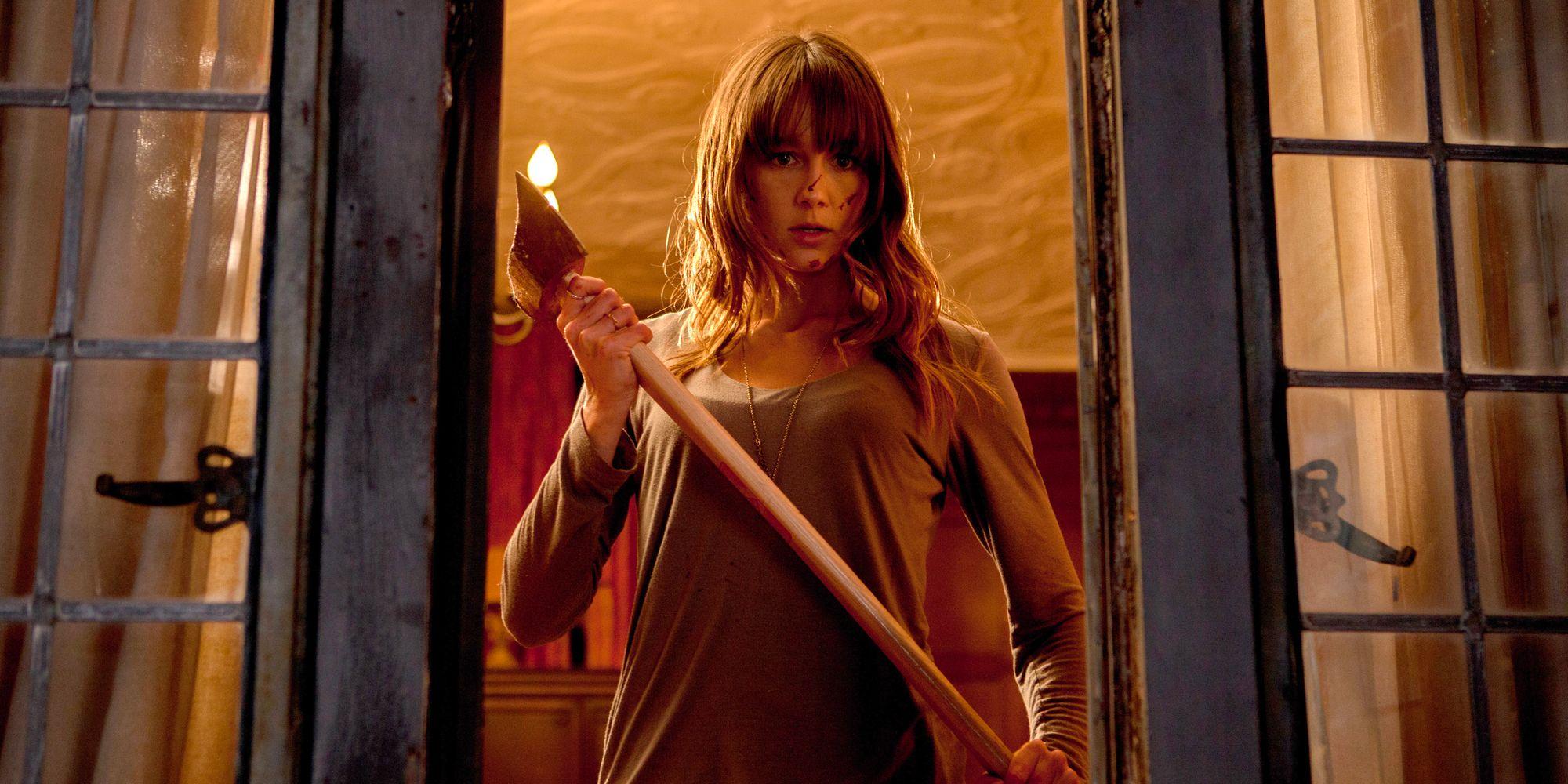Sharni Vinson holding an axe in You're Next