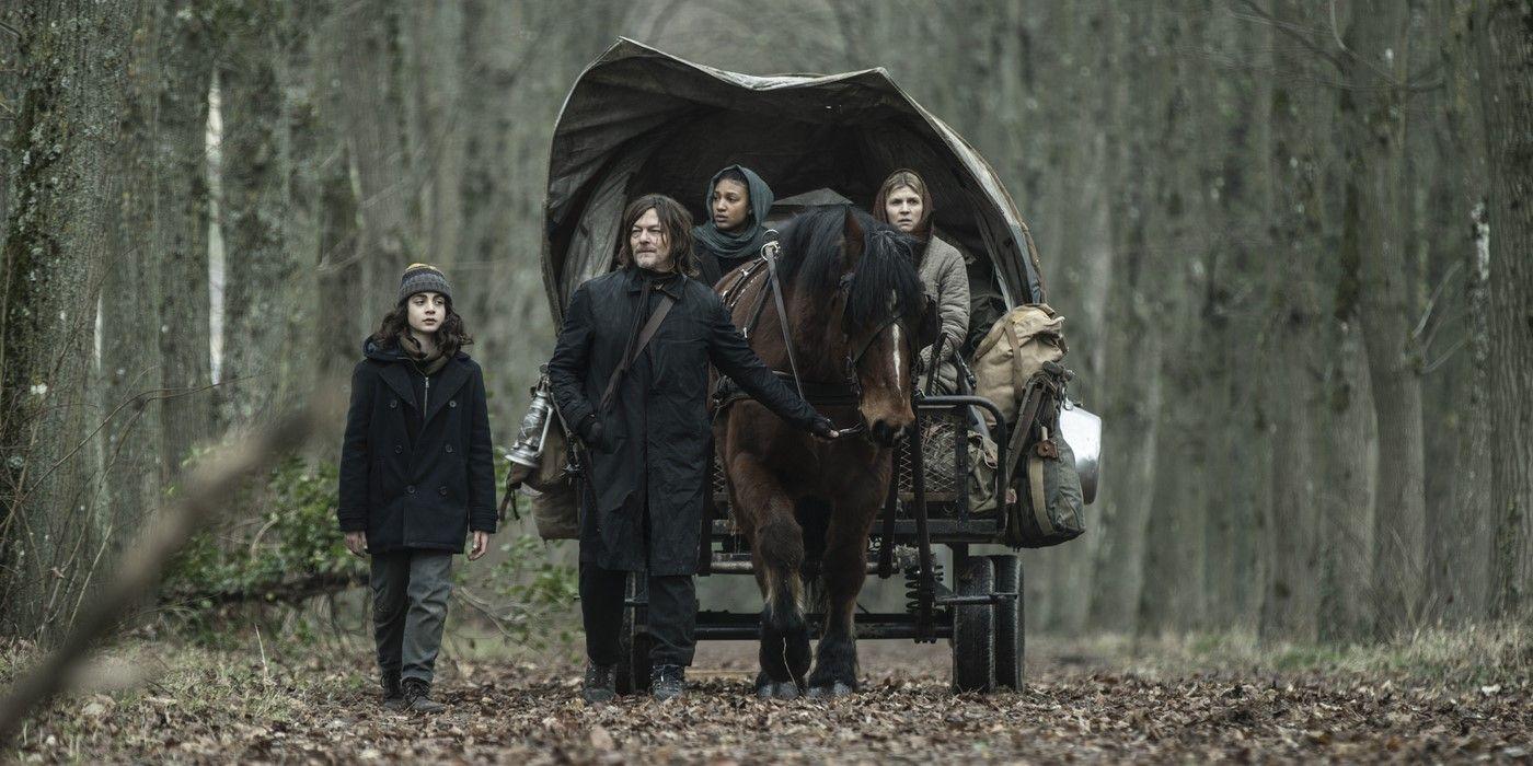 Daryl Dixon played by Norman Reedus walks next a horse and wagon with Lauren played by Louis Puech Scigliuzzi in The Walking Dead: Daryl Dixon